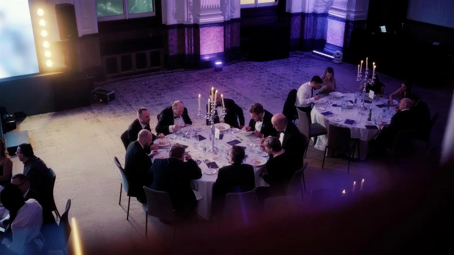 Guests dining at a candlelit round table during last year's event